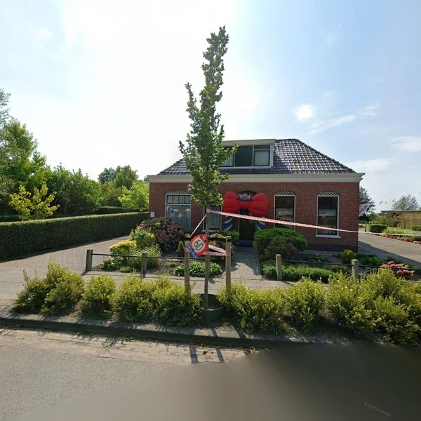 Straatbeeld van Hoofdstraat 22, 9973PG Houwerzijl